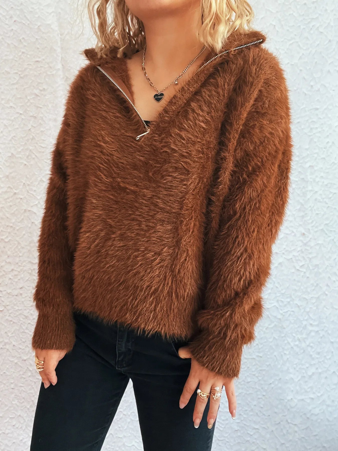 Brown fuzzy half-zip sweater with V-neck and ribbed cuffs