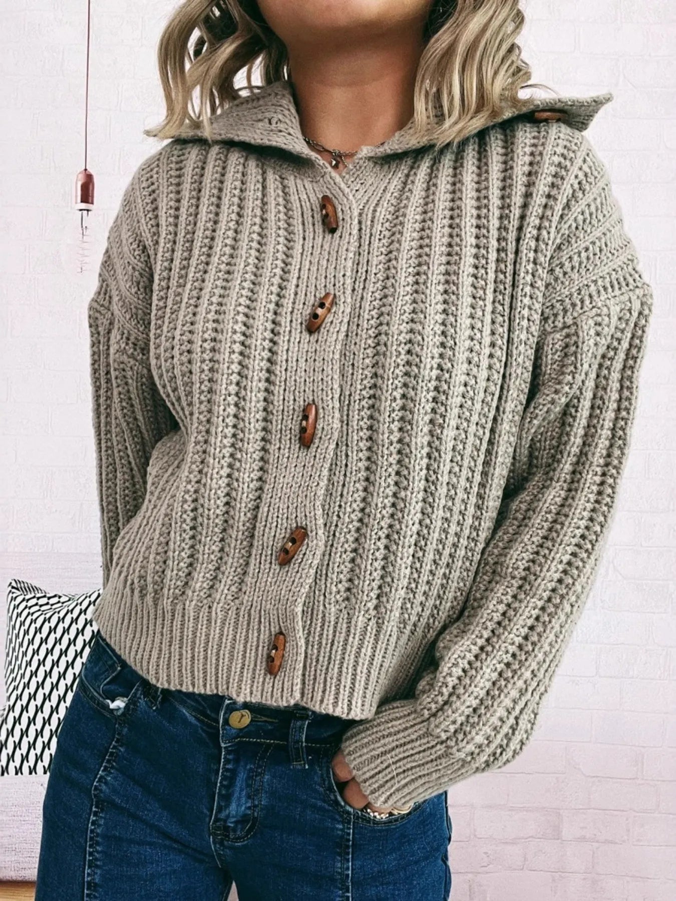 Khaki button-up long-sleeve cardigan with ribbed texture and brown button placket, front view