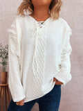 White raw-hem lace-up sweater with cable knit texture and fringe cuffs