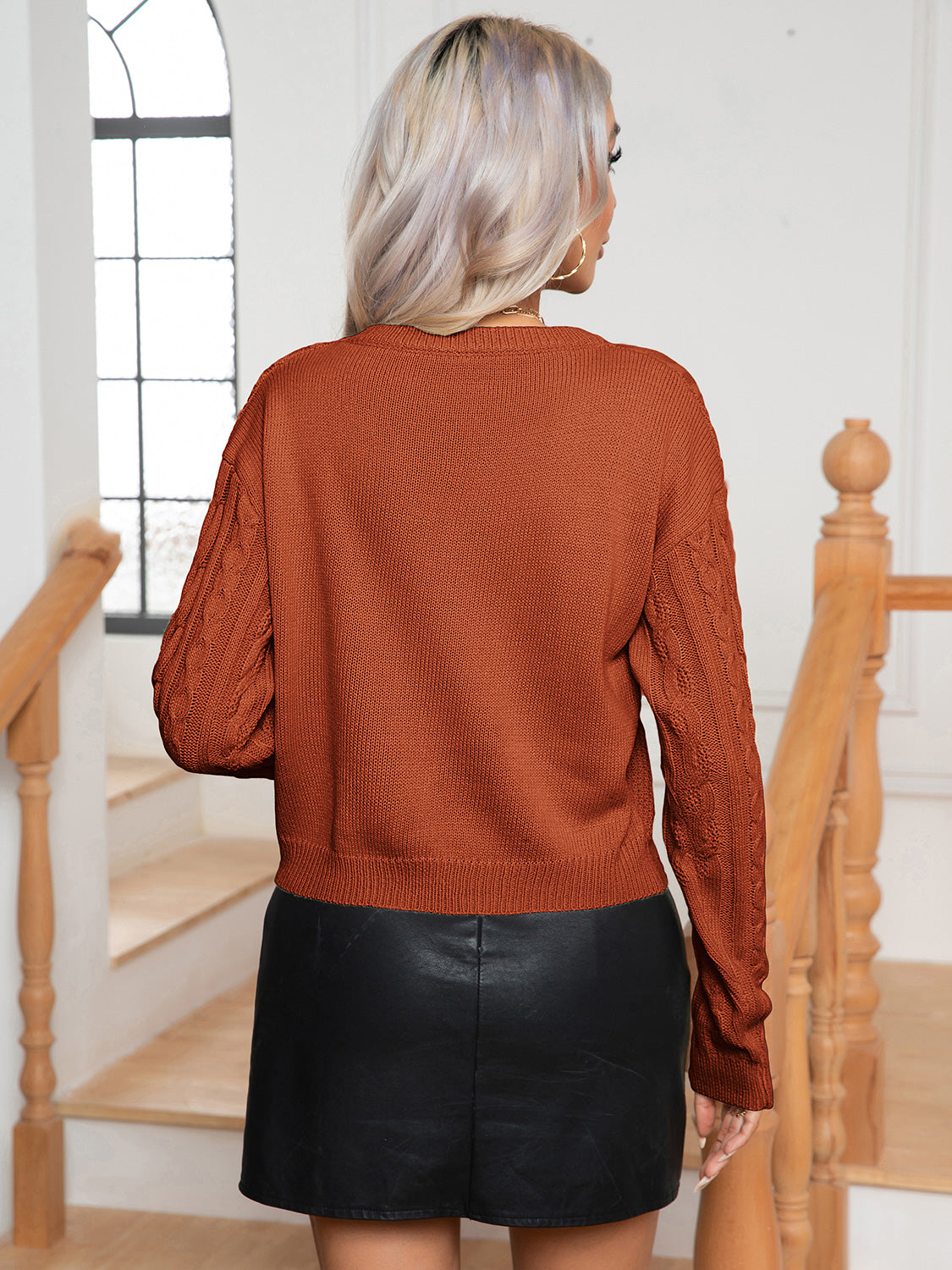 Caramel cable-knit round-neck sweater, back view, long sleeves and ribbed hem and cuffs
