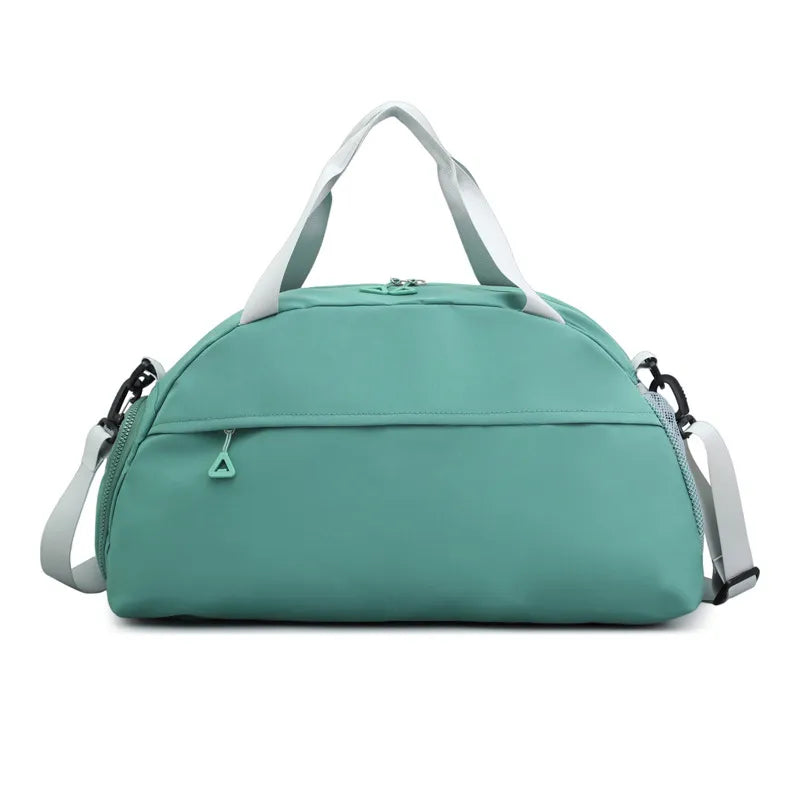 Large nylon travel duffle bag, turquoise with front zip pocket and shoulder straps