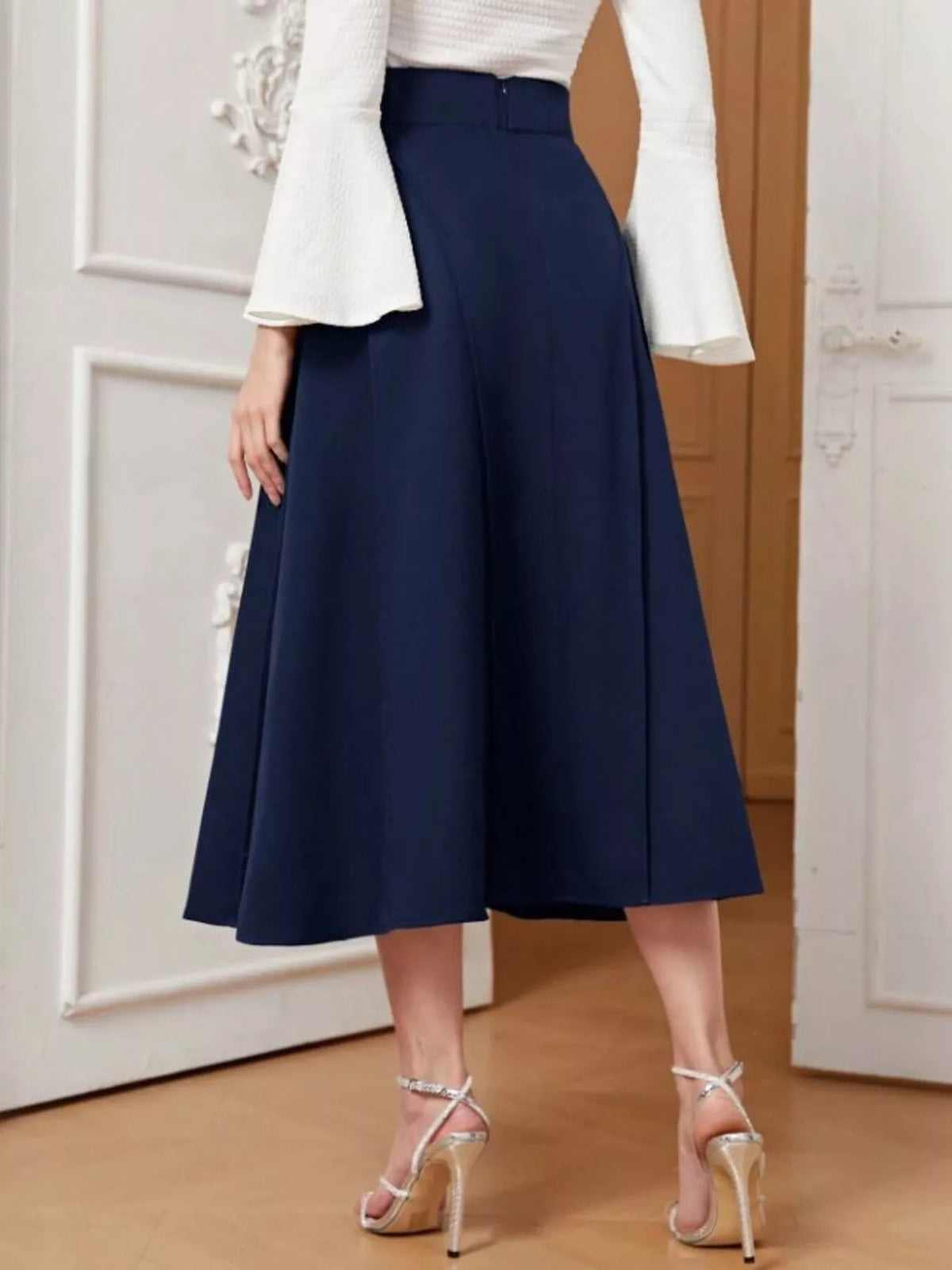 Dark blue A-line midi skirt with full flared silhouette