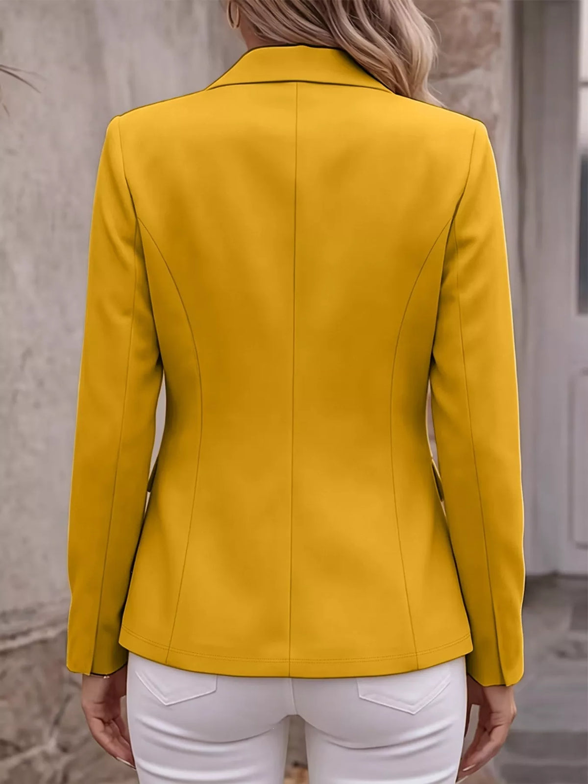 Back view of yellow lapel long-sleeve blazer with tailored seams and slim waist fit