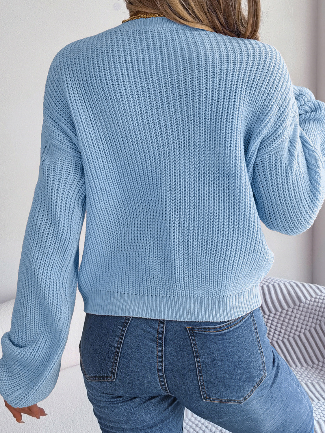 Misty blue cable-knit sweater back view, drop shoulder, textured knit