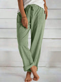 Matcha green wide-leg pants with elastic waist, drawstring tie, and side pockets