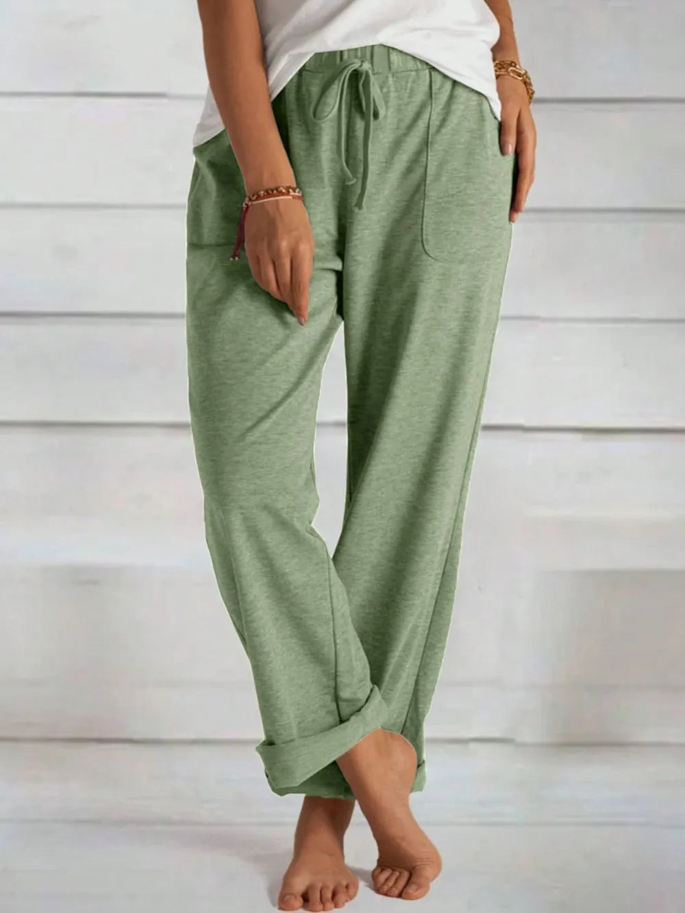 Matcha green wide-leg pants with elastic waist, drawstring tie, and side pockets