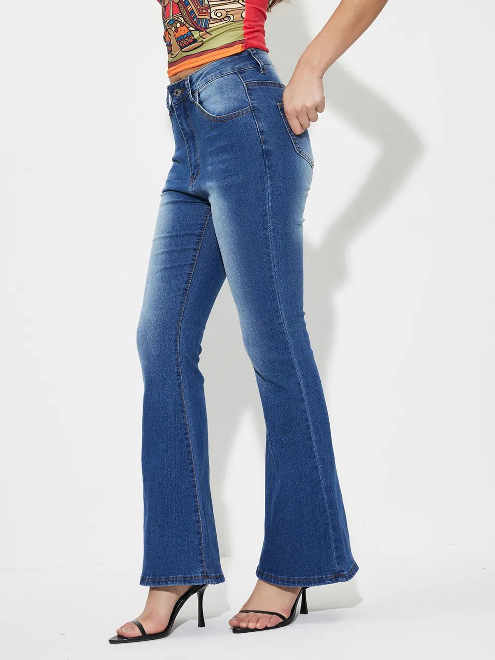 Mid-rise bootcut jeans, medium blue wash, belt loops and straight bootcut