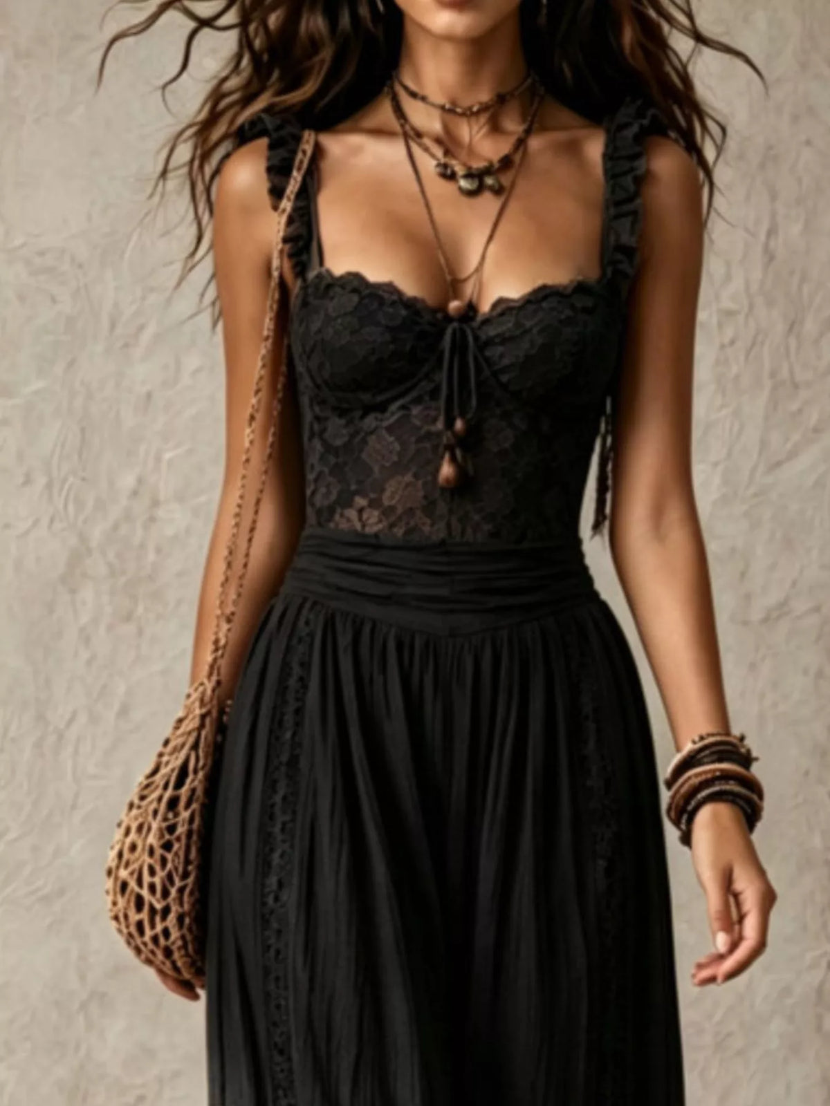 Black lace corset jumpsuit with lace bodice and gathered waist over harem pants