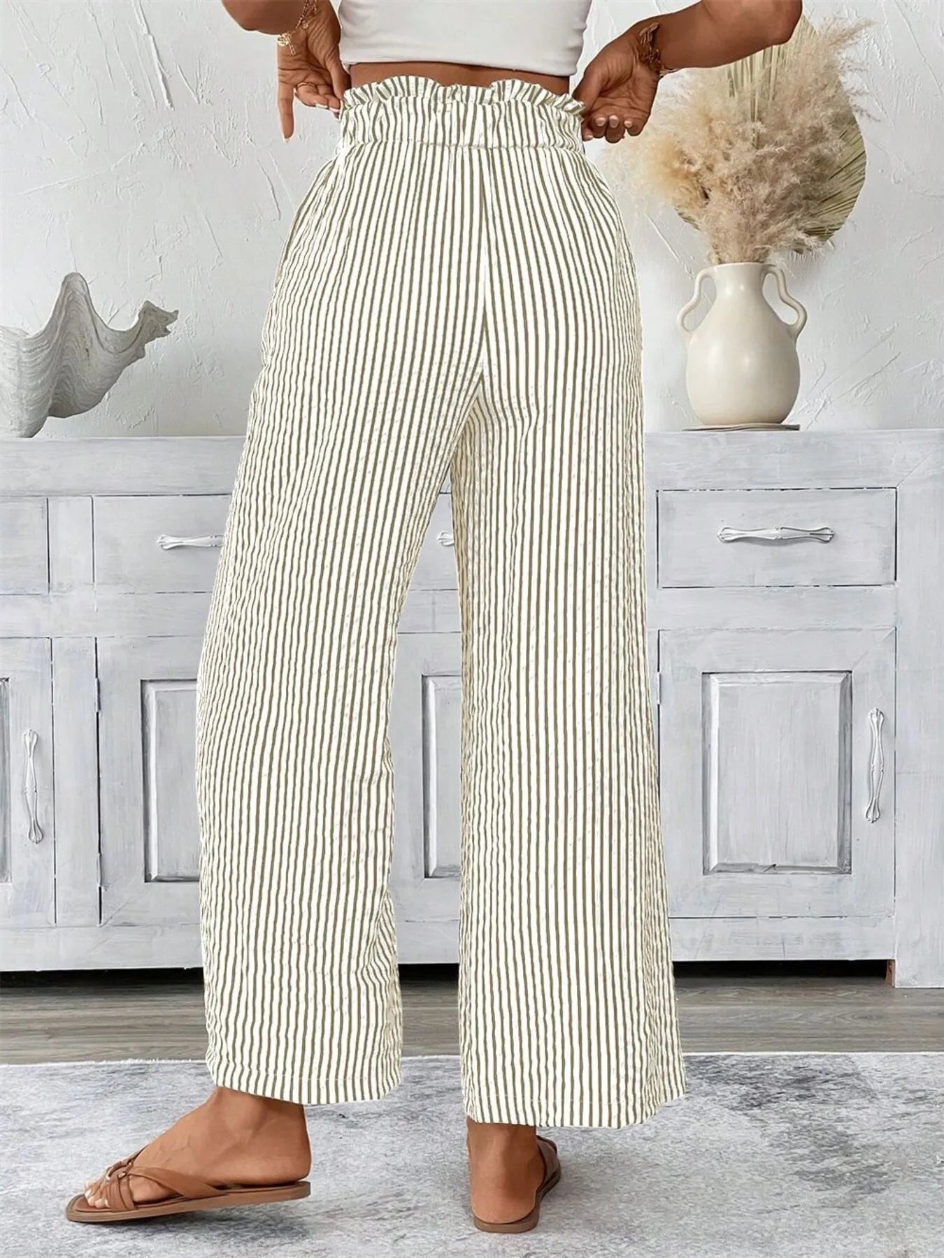Striped wide-leg paper bag pants, cream with dark vertical stripes and elastic tie waist