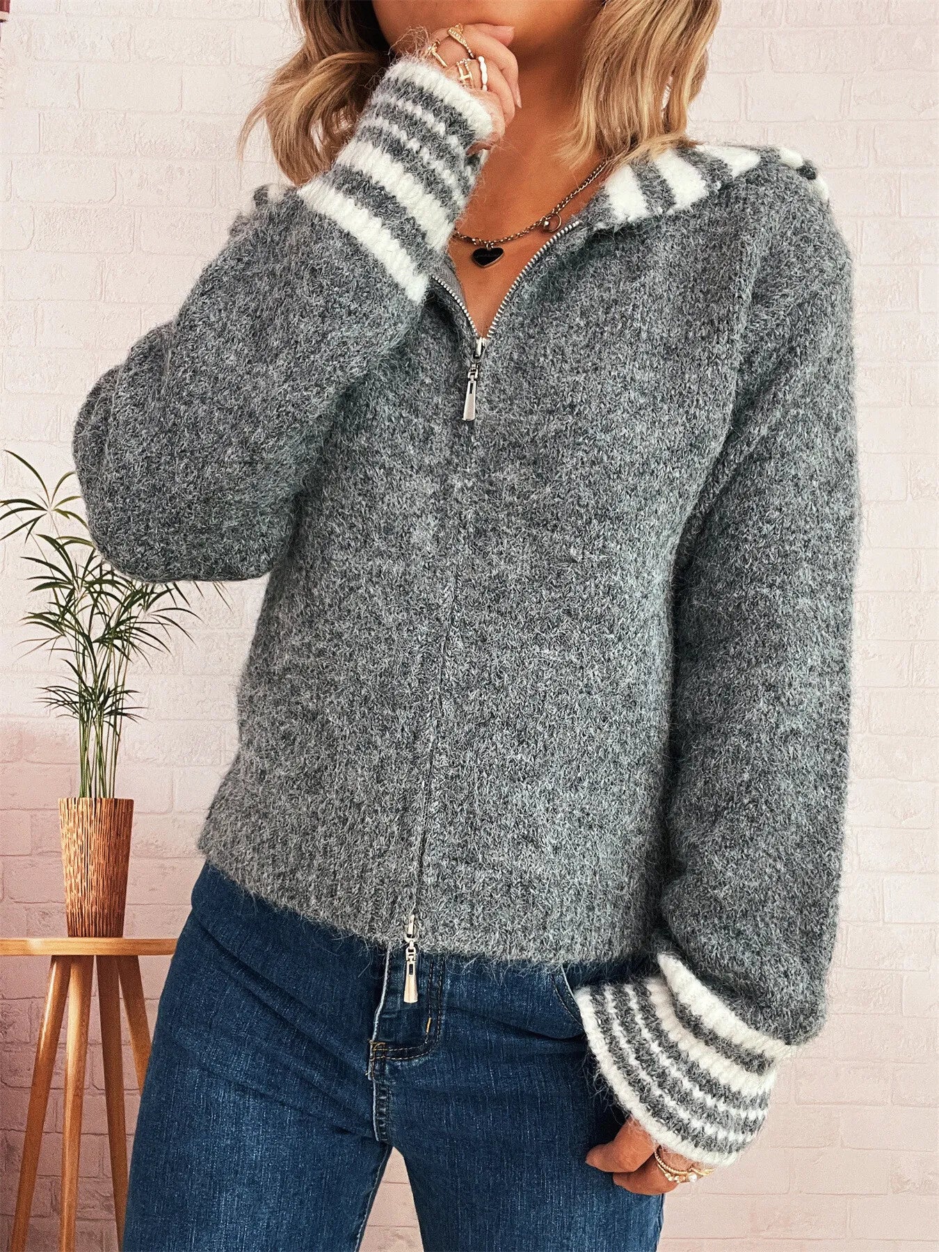 Gray zip-up cardigan with striped collar and sleeve cuffs, quarter zipper front