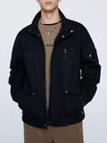 Black zip-up lightweight jacket with stand collar, front pockets, and zipper pull