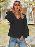 Black V-neck long sleeve blouse with puff sleeves and textured fabric