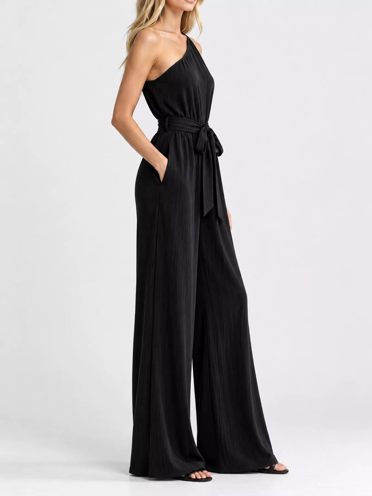 One-shoulder pleated wide-leg jumpsuit, black with tied waist and flowy wide legs