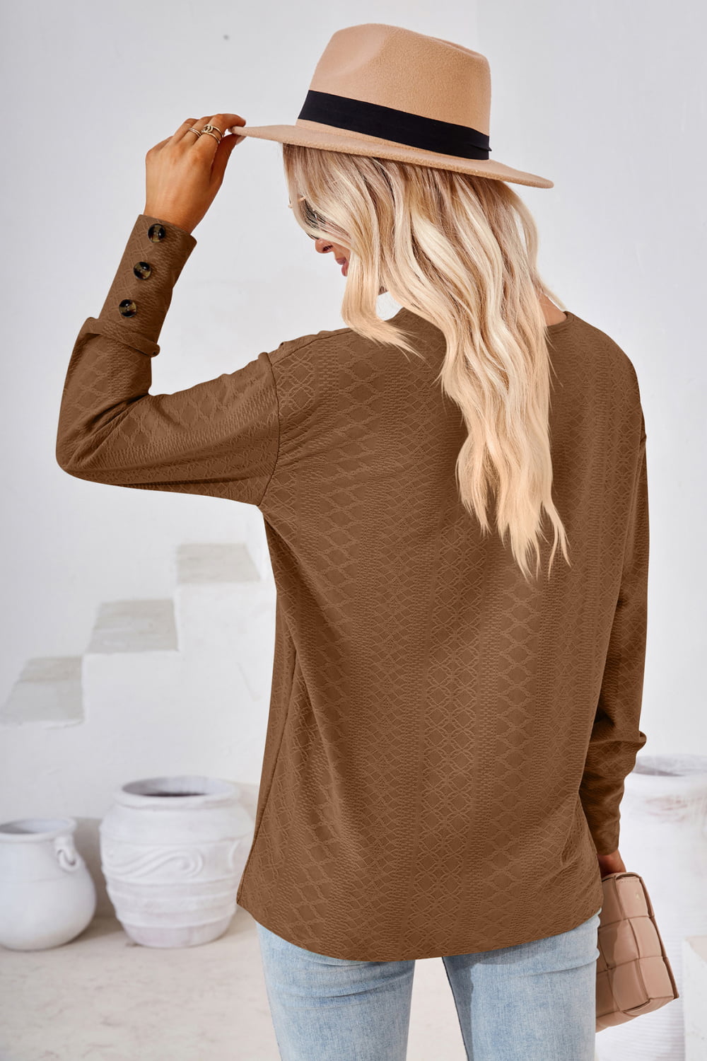 Brown V-neck long-sleeve blouse back view with diamond texture and buttoned cuffs