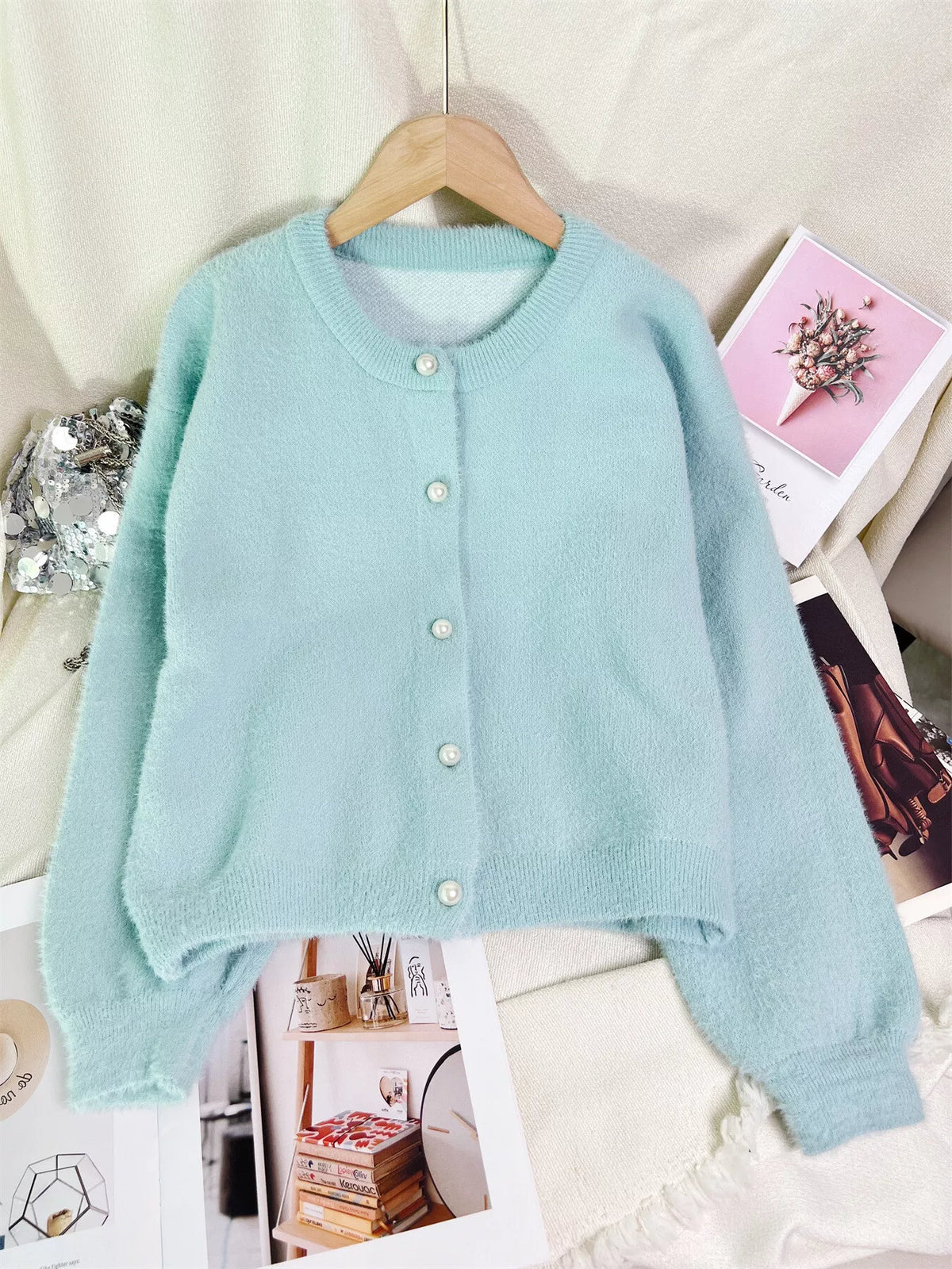 Light blue fuzzy knit button-down cardigan sweater with pearl-like front buttons