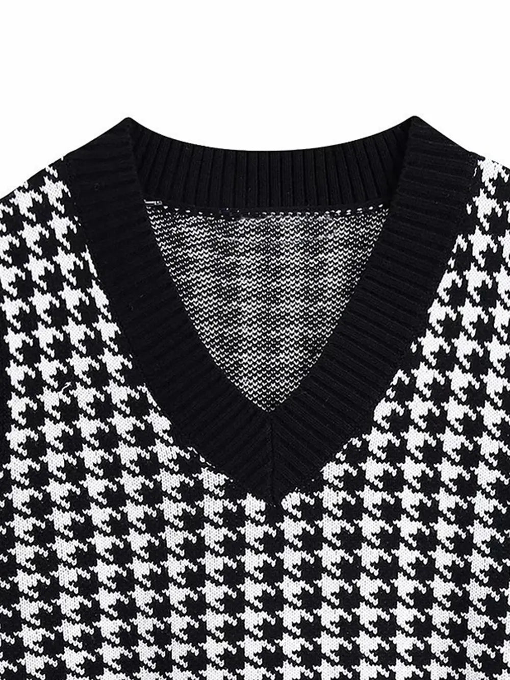 Black houndstooth V-neck sweater vest with ribbed collar and sleeveless knit texture