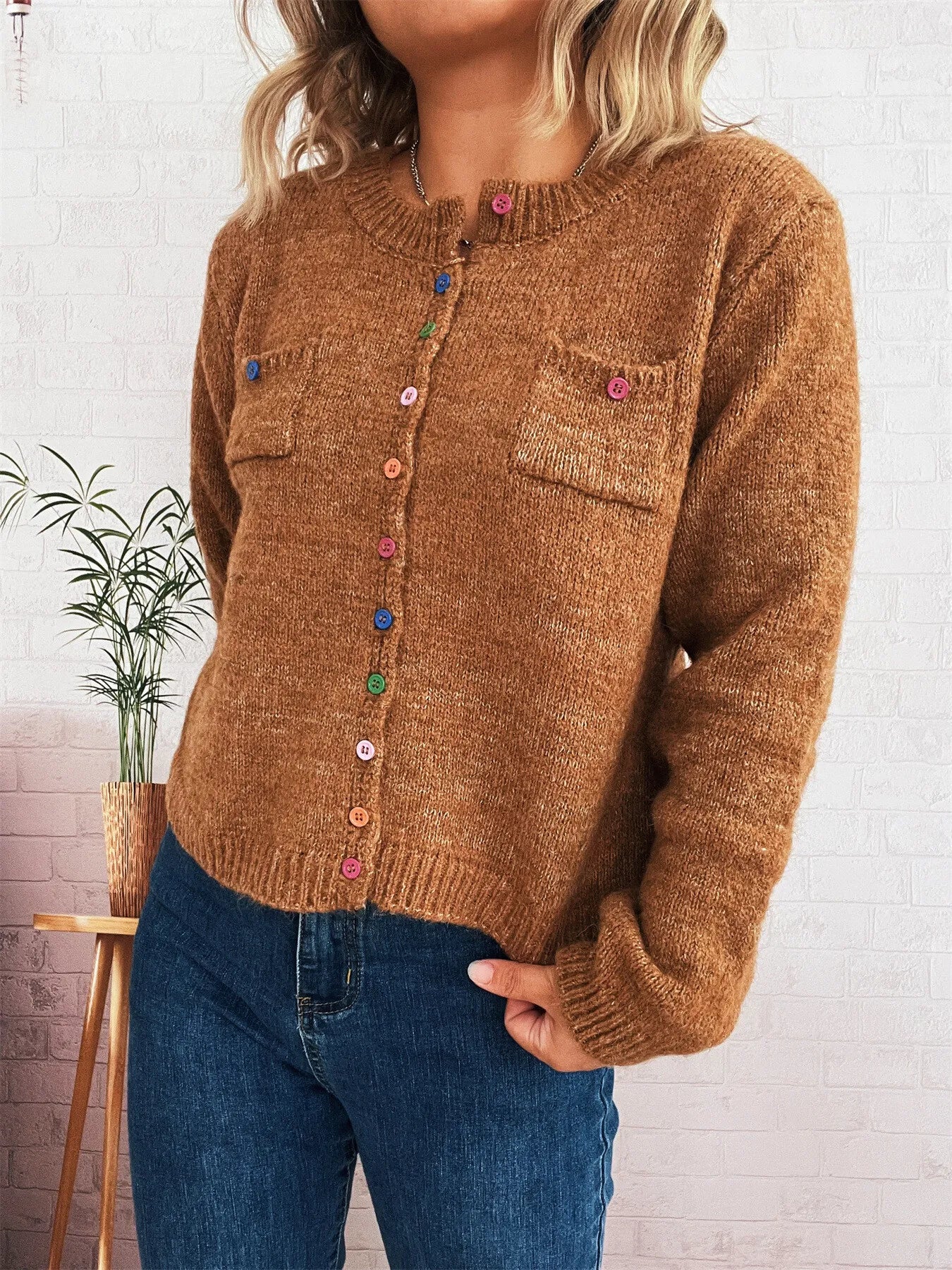Brown knit button-up cardigan with chest pockets and multicolor button front