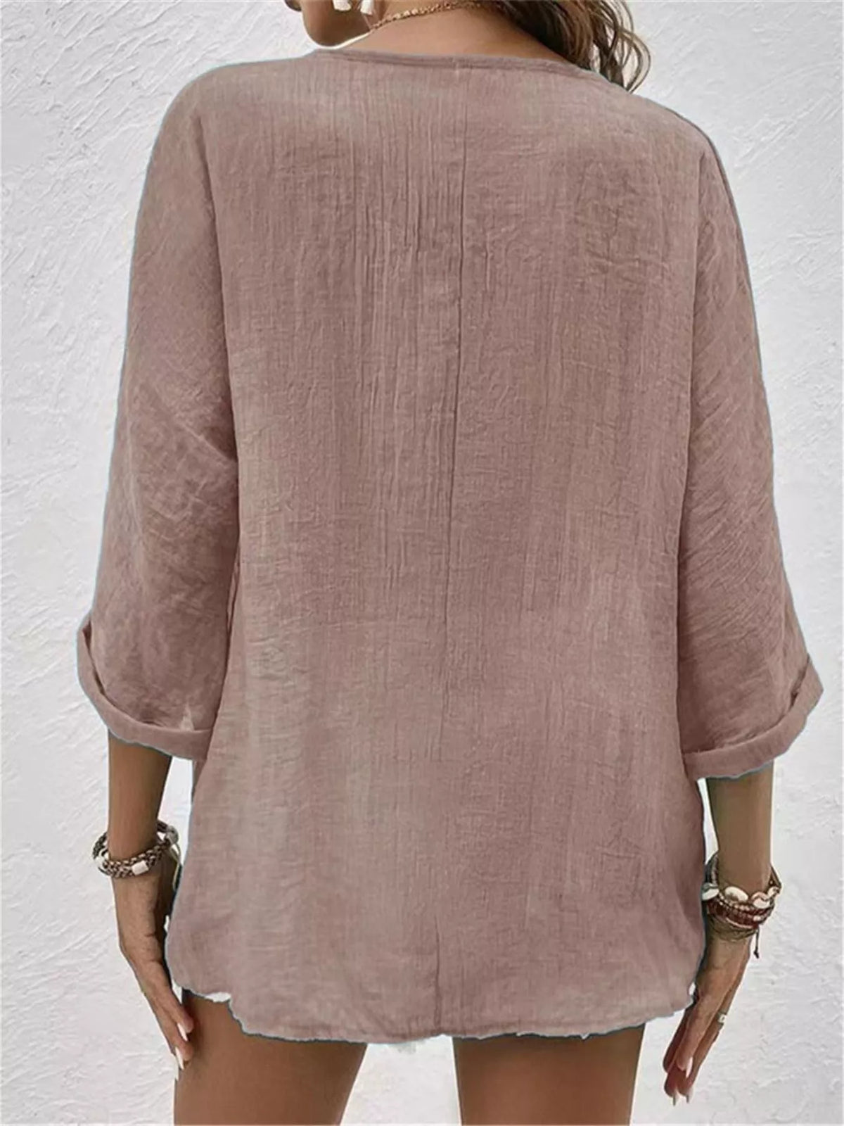 Dusty pink button-front blouse with 3/4 sleeves, relaxed fit
