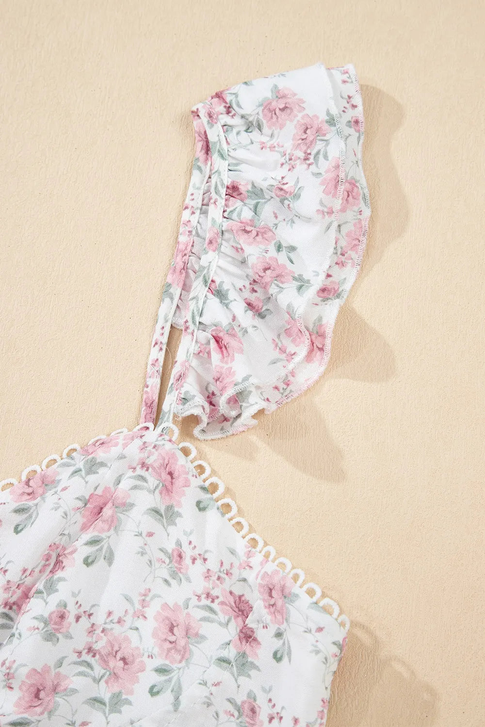 Floral peplum tank top on hanger, blush pink floral print with ruffled strap detail
