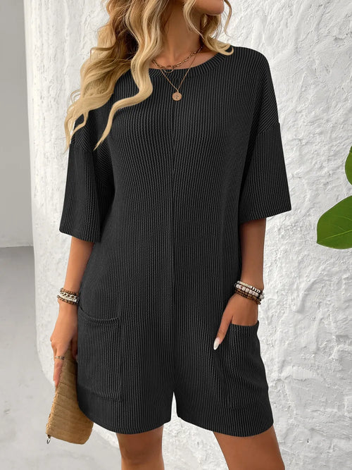 Backless textured round-neck romper, black, half sleeves, loose shorts silhouette