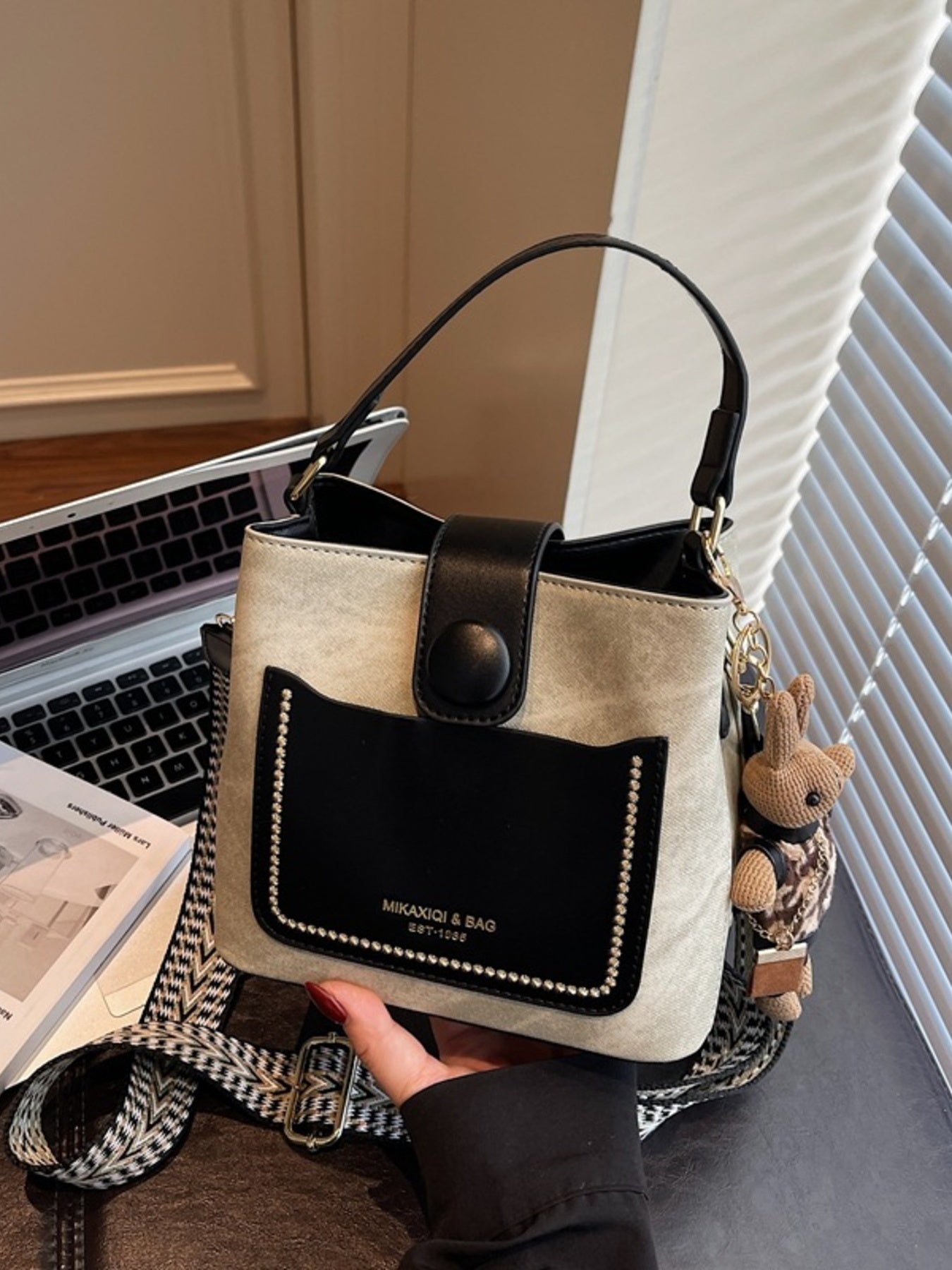Two-Tone Bucket Crossbody Bag, small PU, beige body with black front pocket and rhinestone trim