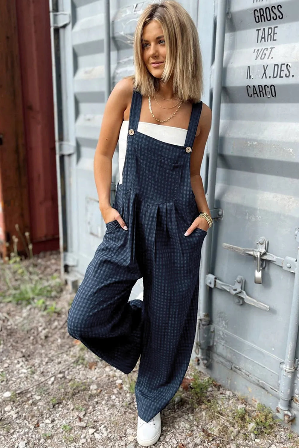 Dark blue plaid wide-leg overalls with wide straps, deep pockets, button front