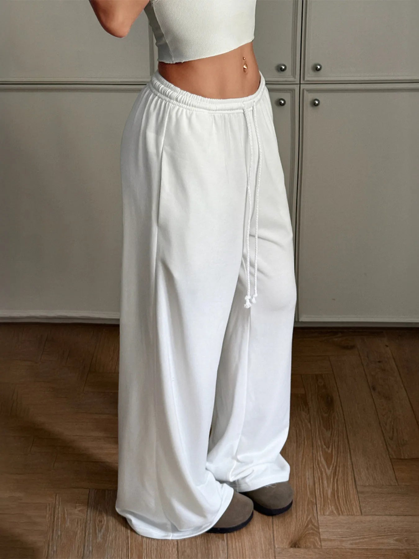 White wide-leg drawstring pants, full length with side drawcord detail and elastic waist