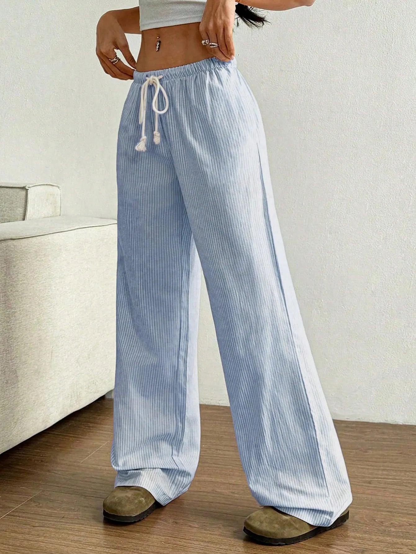 Light blue striped wide-leg pants with elastic drawstring waist, loose wide legs