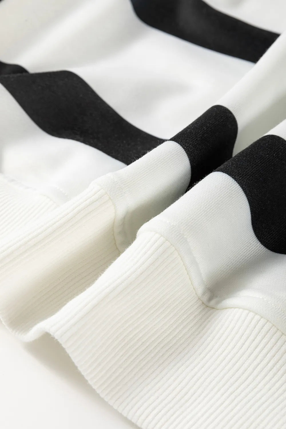 Cream knit fabric with black horizontal stripe