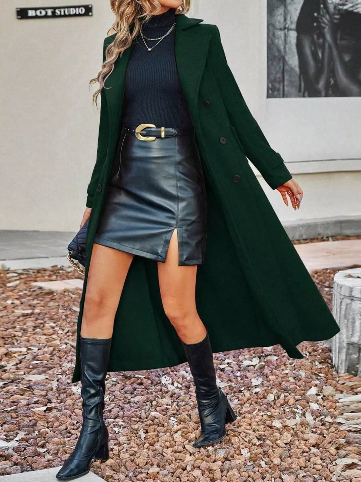 Women’s dark green double-breasted longline coat with notched lapels and button closure