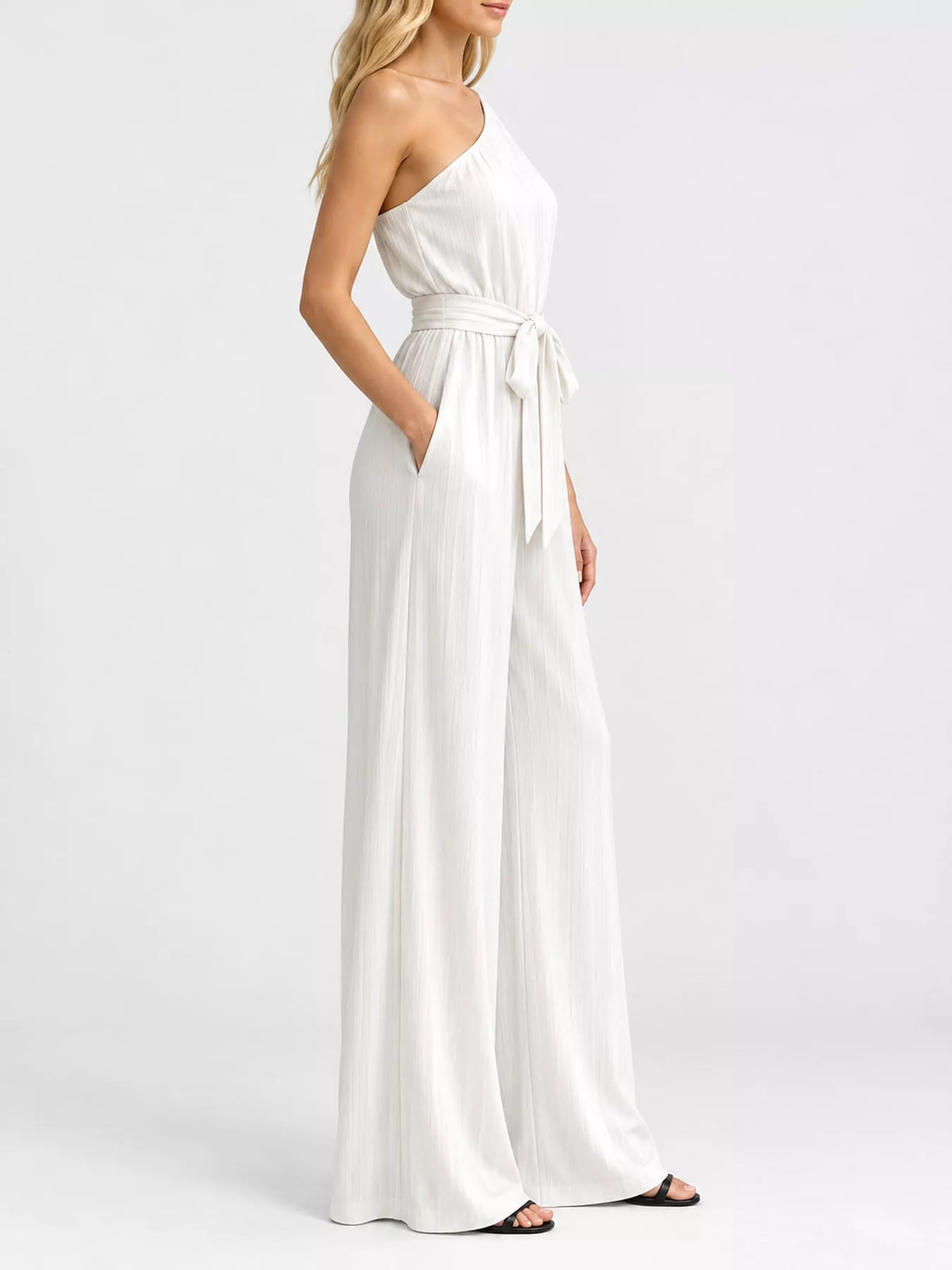 One-shoulder pleated wide-leg jumpsuit, white with tied waist and flowing wide legs