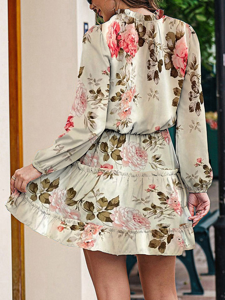 Ivory floral tie-neck long-sleeve dress with gathered waist and ruffle tiers