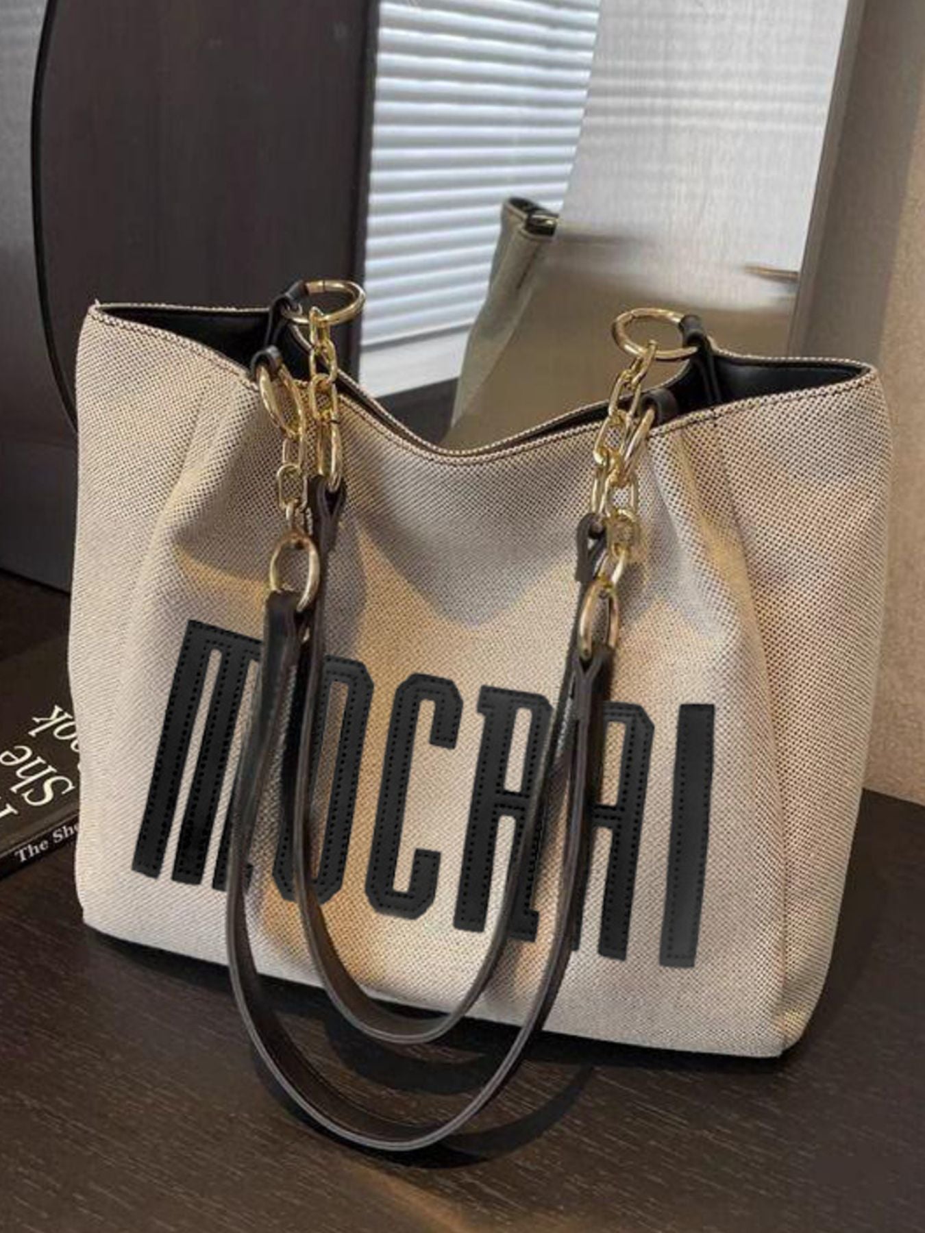 Letter Canvas Shoulder Bag, medium beige canvas with large black lettering and gold-tone chain straps.