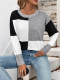 Grey, black, and white color-block knit long-sleeve sweater with ribbed crew neck