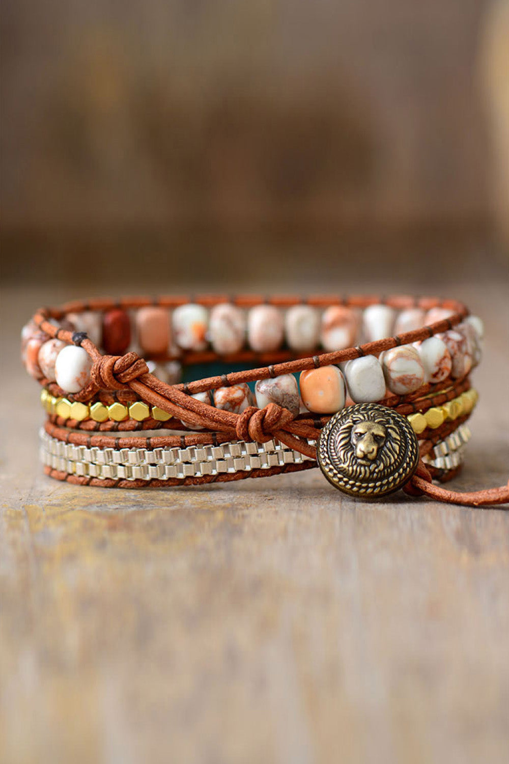 Multi-row beaded copper bracelet with white and earthy beads and round lion clasp