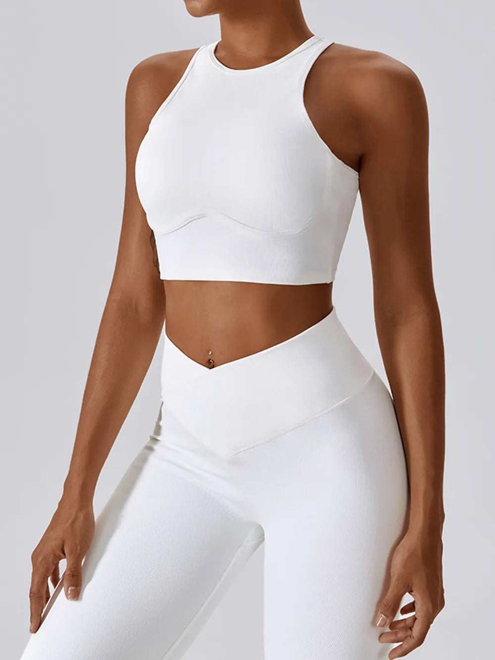 White racerback active crop tank top with molded chest seam details