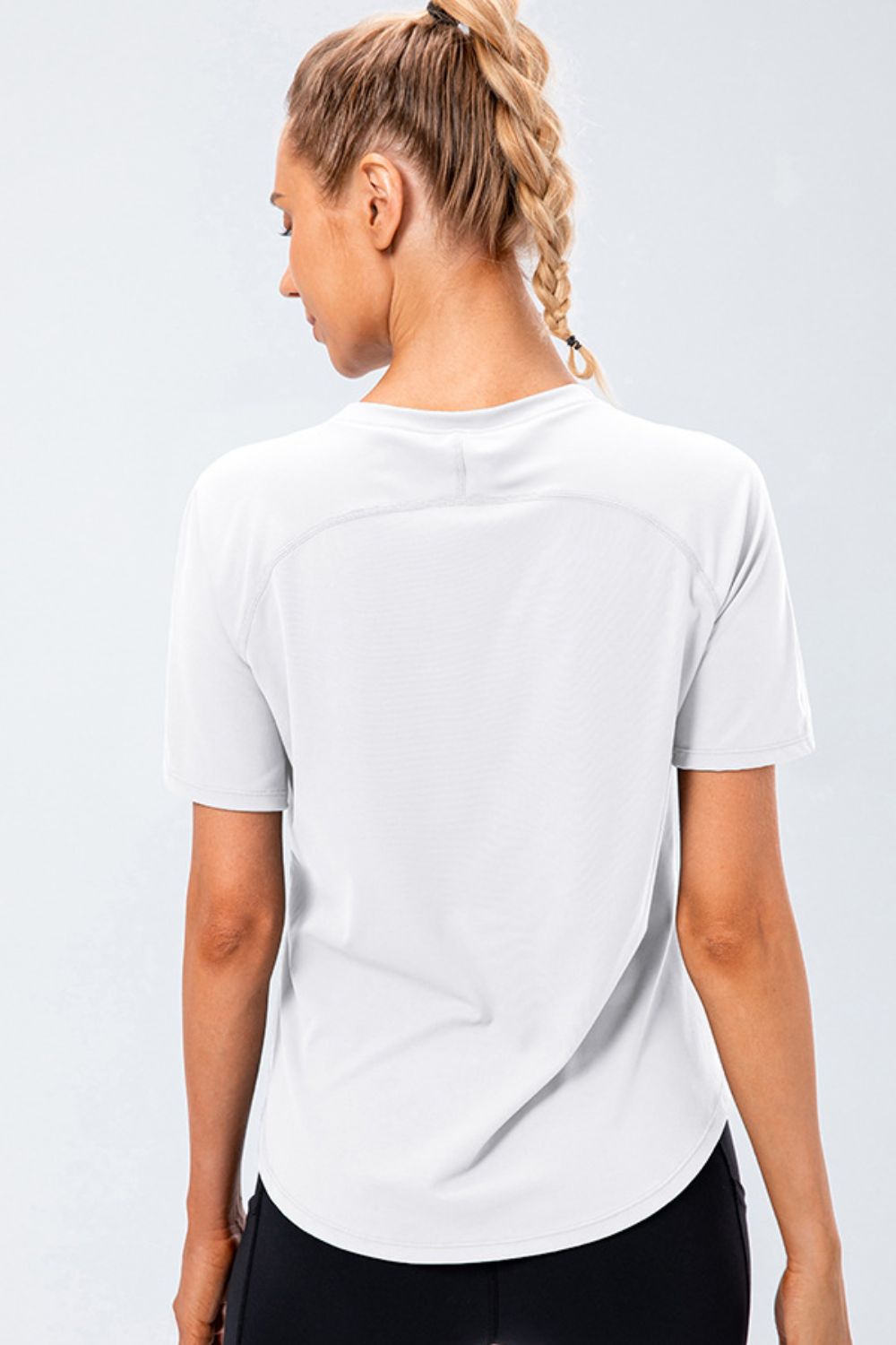 White active tee with round neck and raglan sleeves, back view