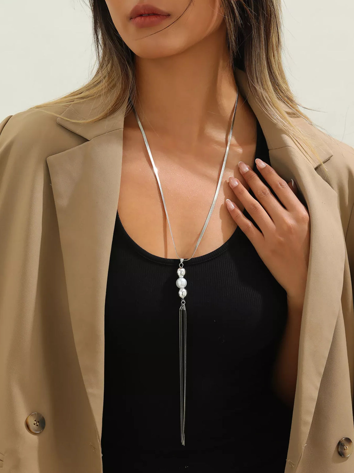 Silver bead tassel pendant necklace with long dangling strands