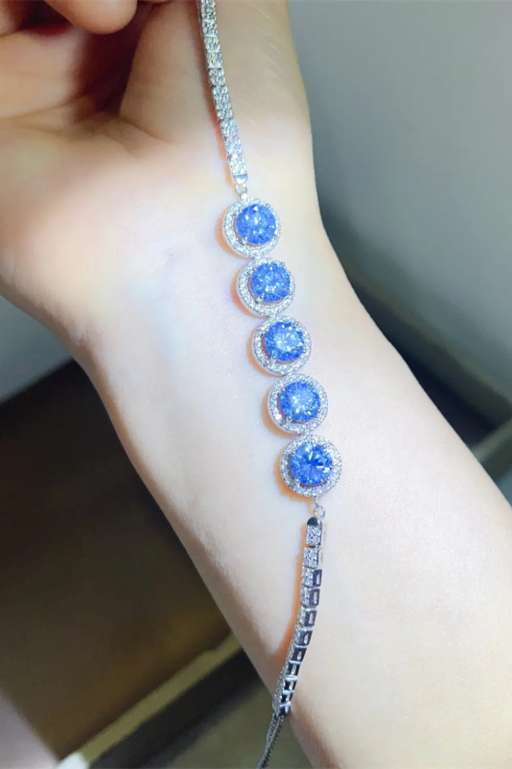 925 sterling silver bracelet with blue round moissanite stones and clasp