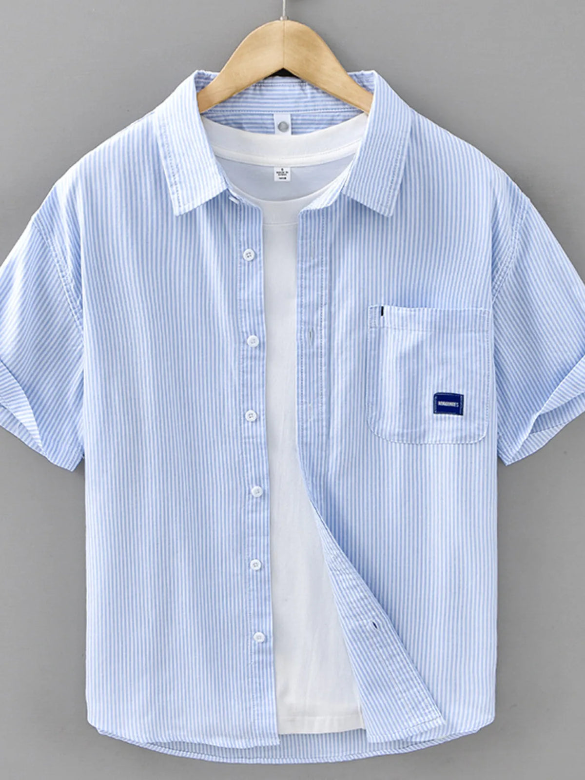 Mens blue striped short-sleeve button-up cotton shirt with chest pocket and logo