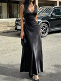 Black lace-trim V-neck sleeveless maxi dress, fitted bodice and flowing skirt.