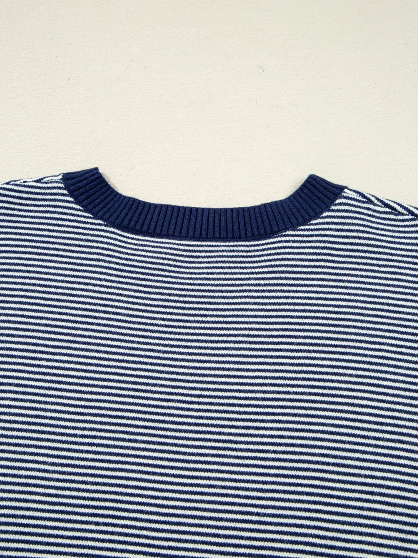Navy and white striped knit tunic sweater with ribbed crew neck and wide neckline band