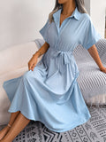 Light blue short-sleeve collared tie belt dress with button front and gathered skirt