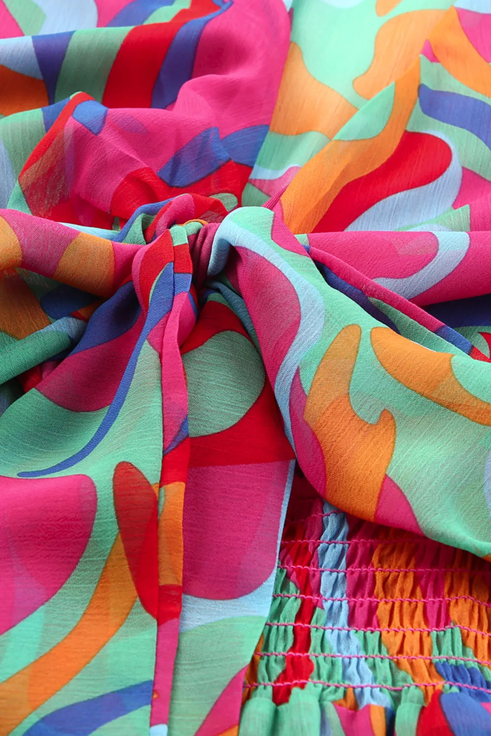Printed Flounce Sleeve Mini Dress with bright multicolor abstract print, tied waist, smocked waistband