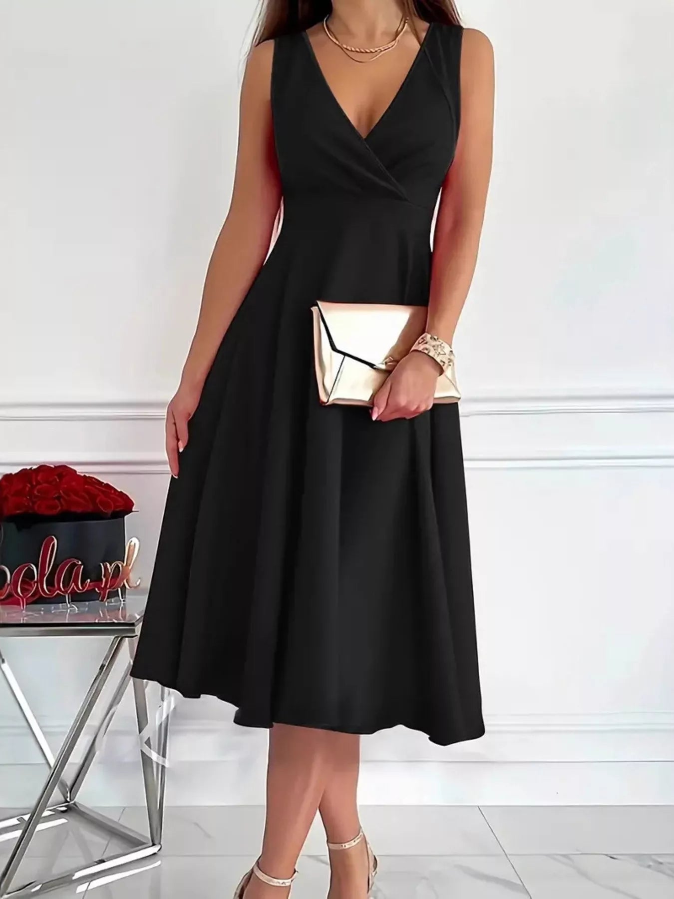 Black sleeveless V-neck A-line midi dress with gathered, flared hem