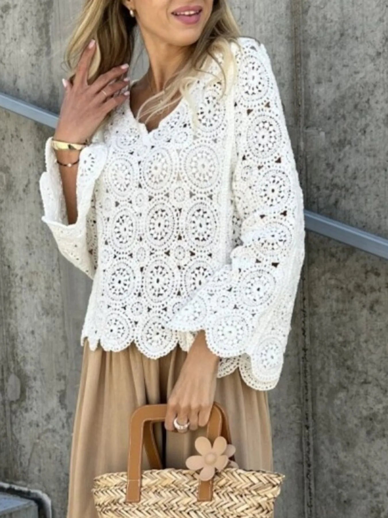 White crochet lace knit top with V-neck, openwork circular pattern and bell sleeves