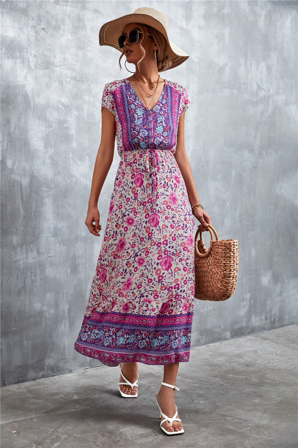 V-neck short sleeve printed maxi dress, purple base with pink floral border and blue trim.