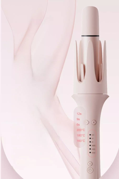 Blush pink automatic rotating curling iron with curling barrel and control buttons