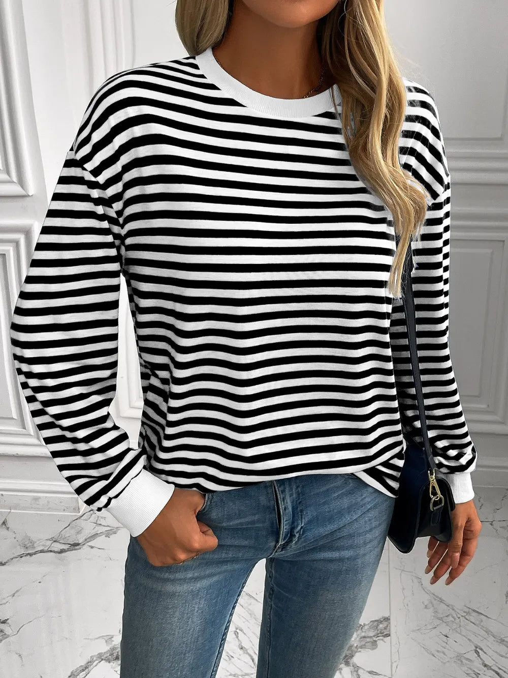 Striped crewneck long-sleeve sweatshirt in black and white, front view
