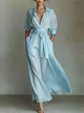 Sky blue maxi shirt dress with tie waist sash and button front, puff sleeves